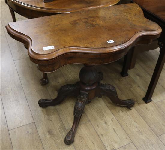 A Victorian walnut card table W.90cm.